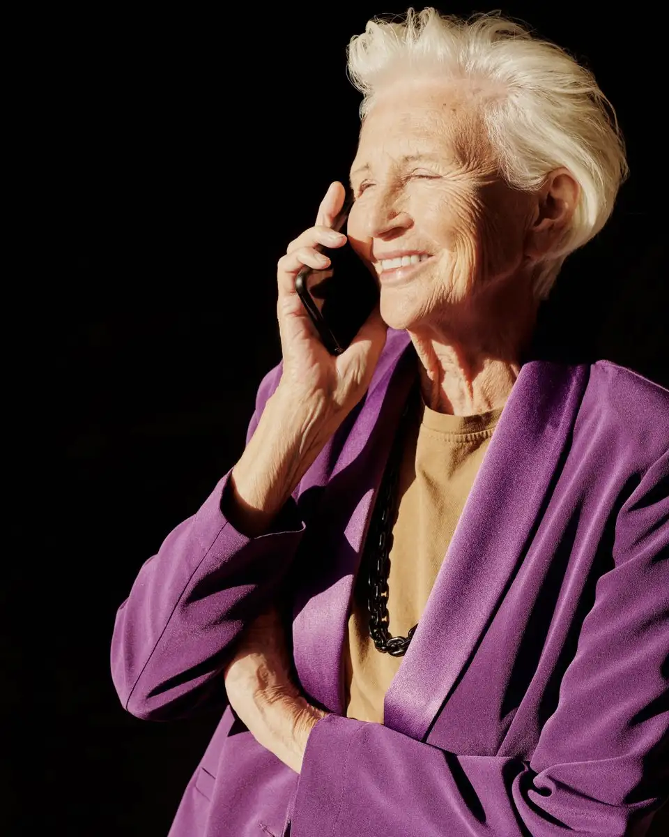 Older woman smiling while on the phone